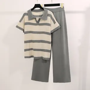 Detail view of the striped polo neck top and matching high-waist knit pants