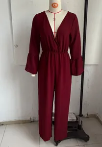 Detail view of burgundy V-neck wide-leg jumpsuit with flared sleeves on mannequin