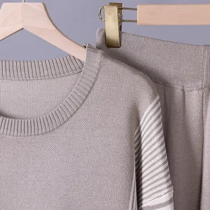 Close-up of a mauve knitted casual set showing round neck and striped sleeve details