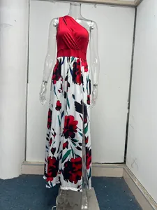 Detail of one-shoulder maxi dress with floral print and side slit on mannequin