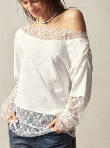 Elegant Bohemian white off-shoulder long sleeve t-shirt featuring intricate lace cuffs