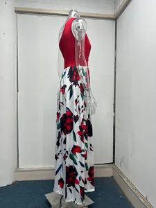 Side view of a sleeveless red and floral maxi dress on a clear mannequin display.
