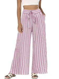 Detailed view of women's pink striped wide-leg trousers with high waist and drawstring