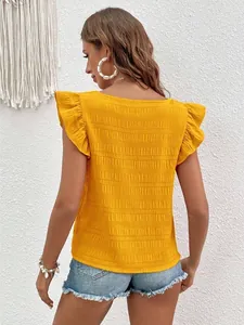 Detailed back view of a yellow women's blouse featuring ruffled sleeves and textured fabric