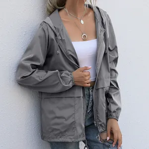 Stylish women's lightweight grey hooded zip-up windbreaker for outdoor hiking and rain