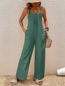 Tuta verde elegante con scollo a V, gamba larga e comode tasche laterali estive