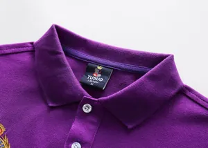 Close-up view of a purple cotton piqué polo shirt featuring a classic collar and crest