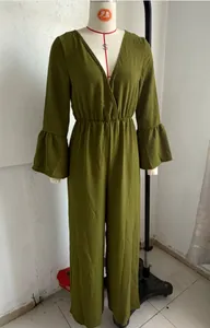 Detailed view of the olive green V-neck long sleeve wide leg jumpsuit on a white mannequin