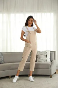 Casual beige jumpsuit overalls with front pockets and adjustable knot straps