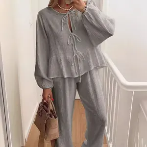 Elegant grey two-piece casual lounge set with lantern sleeves and tie-front top