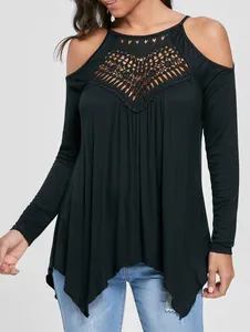 Detail view of black cold shoulder top featuring intricate crochet lace neckline.