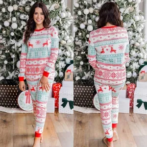 Cozy festive Christmas pajama set with red reindeer and snowflake patterns for home loungewear
