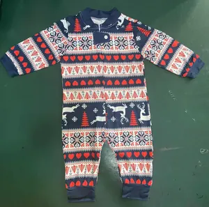 Detailed view of Christmas pattern baby romper featuring reindeer and tree prints