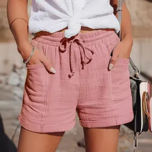 Women's high-waisted drawstring wide-leg shorts in dusty pink textured cotton fabric