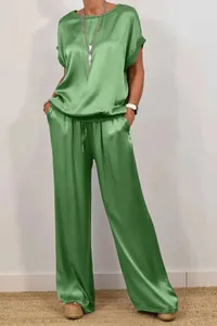 Elegant bright green satin two-piece casual set with loose top and wide-leg pants