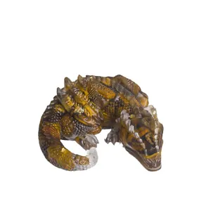 Handcrafted resin dragon figurine with natural crystal chips for home and office decor.