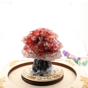 Close-up detail of a handmade red crystal gemstone money tree on a carved wooden base
