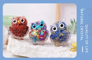 Group of three colorful handmade natural crystal resin owl figurines for shelf decor