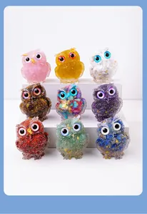 Collection of nine colorful resin owl figurines with crystal gravel for home decoration