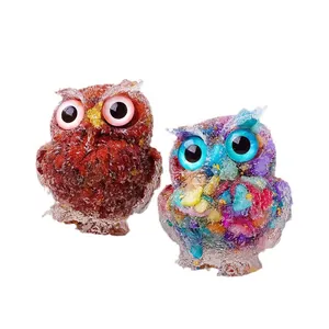 Two colorful resin owl figurines with embedded natural crystal crushed stones