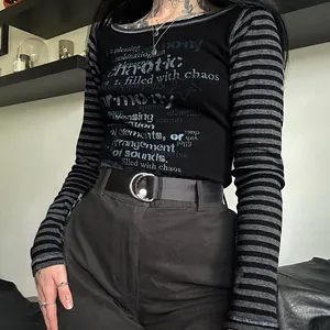 Detailed view of black slim fit long sleeve tee featuring grey stripes and gothic print