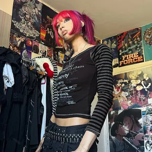 Trendy grunge style black long sleeve T-shirt featuring striped sleeves and graphic print