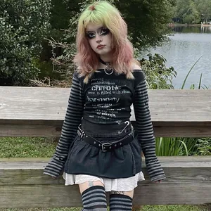 Close-up of black gothic long sleeve T-shirt with white chaotic harmony text print