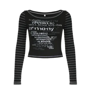 Detail view of black long-sleeve T-shirt with grey striped sleeves and printed graphic