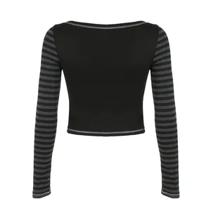 Slim fit black long sleeve crop top with grey striped sleeves and contrast stitching