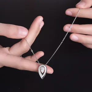 Detailed close-up of a sparkling 1.5ct pear-shaped moissanite pendant on S925 silver chain.