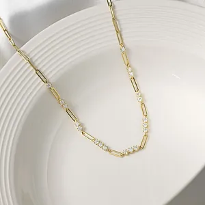 Macro detail view of elegant gold S925 silver moissanite paperclip necklace sparkle