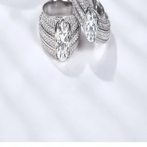 Exquisite macro detail of a 2 carat oval moissanite men's ring with full pavé diamond setting.