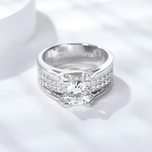 Luxury 2-carat moissanite men's ring with full pavé diamond accents on a silver band.