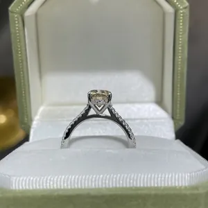 Elegant S925 sterling silver ring featuring a 2ct champagne moissanite in a green box