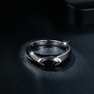 Detailed close-up view of sterling silver band ring with marquise-cut black moissanite