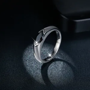 Close-up view of marquise-cut black moissanite stone set in a sleek silver ring band.