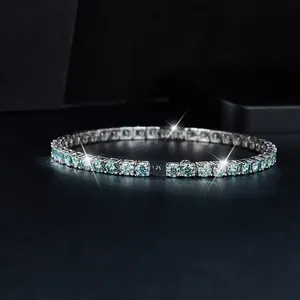 Elegant 925 silver tennis bracelet featuring sparkling blue-green moissanite stones.