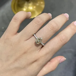 Elegant S925 sterling silver ring featuring a 2ct champagne moissanite on a hand.