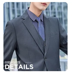 Close-up of premium dark grey business suit with striped tie and vest details