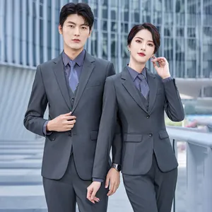 Matching professional grey business suit set for men and women shown in an outdoor setting