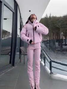 Premium women's stylish pink hooded ski jacket and matching trousers set for winter