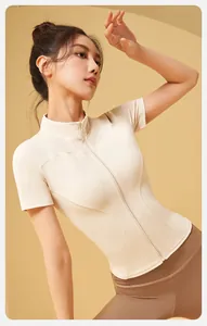 Slim fit beige zip-up yoga top with short sleeves and high elastic nude feel fabric