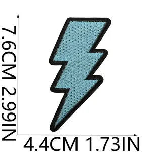 Macro view of light blue embroidered lightning bolt patch showing size 7.6cm by 4.4cm
