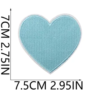 Close-up of light blue heart-shaped embroidered patch showing size 7.5cm by 7cm dimensions