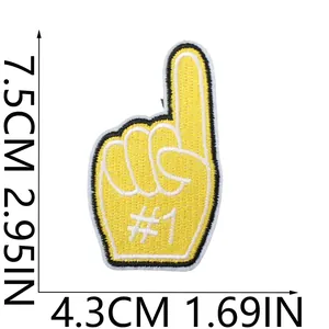 Detailed view of a yellow embroidered foam finger patch showing exact dimensions in CM and IN.
