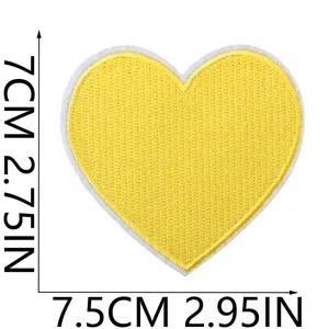 Detailed macro view of yellow heart embroidered patch with 7.5cm x 7cm size markings