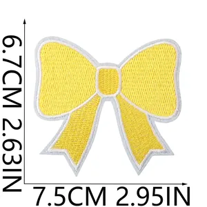 Yellow embroidered bow patch for DIY clothing decoration, size detail 7.5cm x 6.7cm.