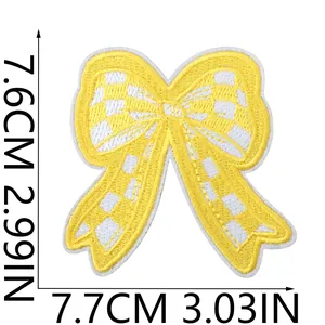 Detailed dimensions of yellow checkerboard bow embroidery iron-on patch, 7.6x7.7cm.