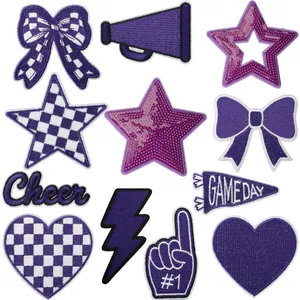 Collection of purple embroidered patches with stars hearts and game day themes for DIY