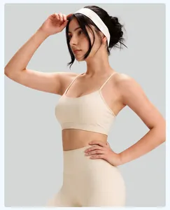Professional side view detail of a beige high-impact yoga sports bra with thin straps